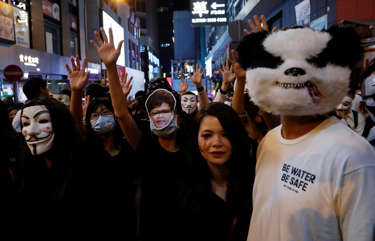 Anti-government protesters wearing costumes march during Halloween in Lan Kwai Fong, Central district, Hong Kong, China on Oct. 31, 2019. (Tyrone Siu/Reuters)