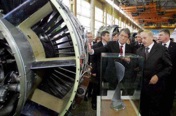Former president of Ukraine Viktor Yushchenko (L) examines a turbo-jet engine while talking to Motor Sich CEO Vyacheslav Boguslayev, at the company's plant in Zaporizhzhya, Ukraine, on Feb. 1, 2006. (Mykola Lazarenko/AFP/Getty Images)