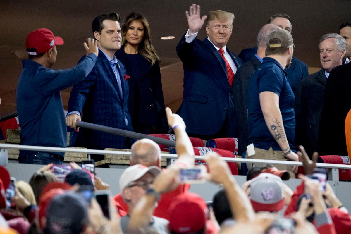 President Donald Trump and First Lady Melania Trump arrive for Game 5 of the World Series baseball game between the Houston Astros and the Washington Nationals at Nationals Park in Washington on Oct. 27, 2019. Also pictured are Rep. Matt Gaetz (R-Fla.) (2nd L) and Rep. Mark Meadows (R-N.C) (R). (Andrew Harnik/AP Photo)
