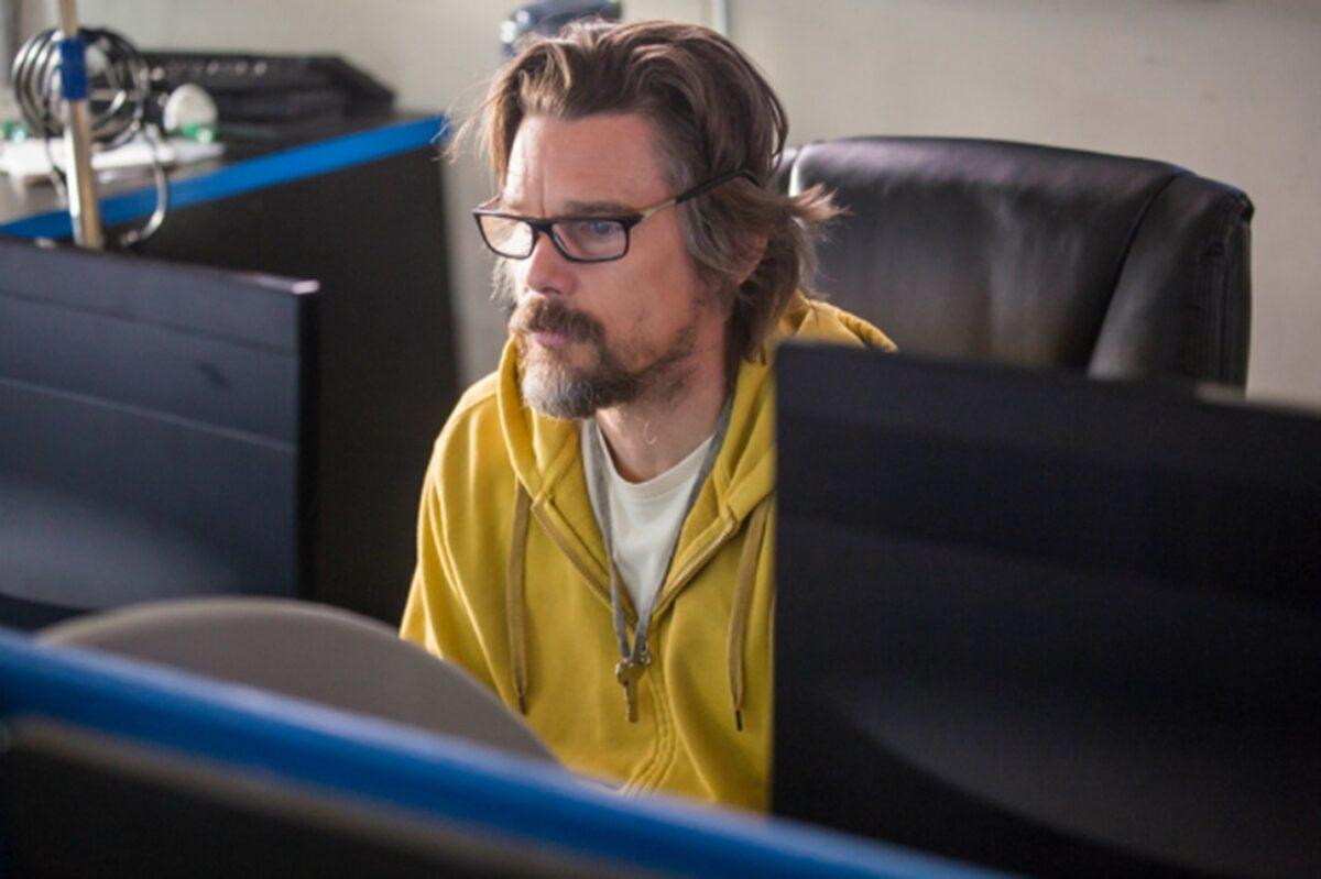 Russell Millings (Ethan Hawke) has to learn the ins and outs of a computer world, in “Adopt a Highway.” (Blumhouse Productions)