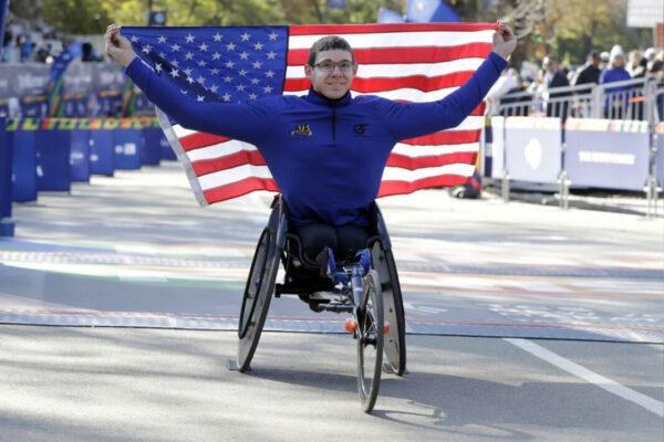 Daniel Romanchuk, of Mount Airy, Md., poses for photos as the winner the pro wheelchair men’s division of the New York City Marathon, in New York’s Central Park on Nov. 3, 2019. (Richard Drew/AP Photo)