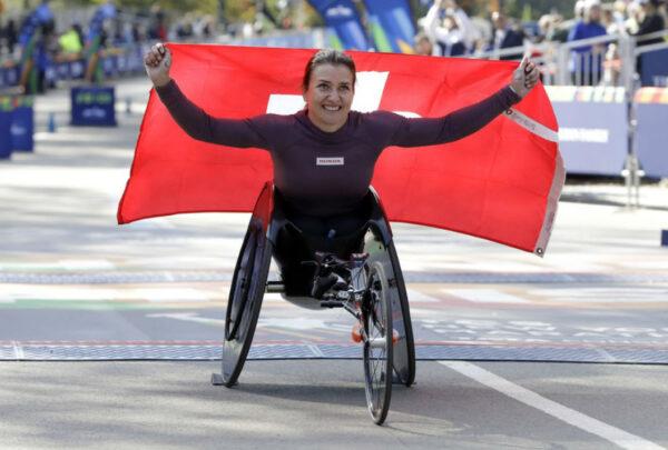 Manuela Schar, of Switzerland, poses for photos as the winner of the pro wheelchair women’s division of the New York City Marathon, in New York’s Central Park on Nov. 3, 2019. (Richard Drew/AP Photo)