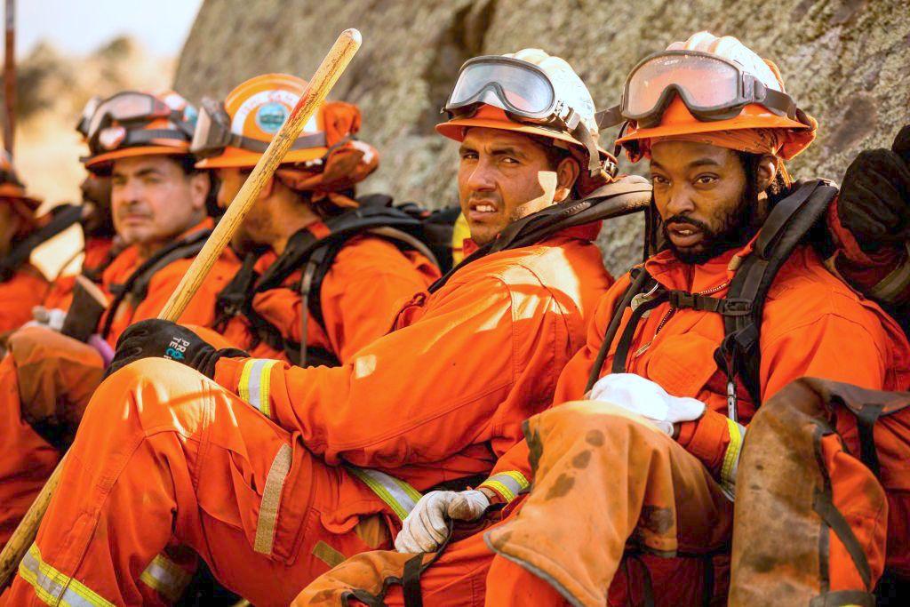 A crew of inmate firefighters takes a break from battling the Kincade Fire in Healdsburg on Oct. 26, 2019. (©Getty Images | <a href="https://www.gettyimages.com.au/detail/news-photo/crew-of-inmate-firefighters-takes-a-break-during-news-photo/1178415181">PHILIP PACHECO/AFP</a>)