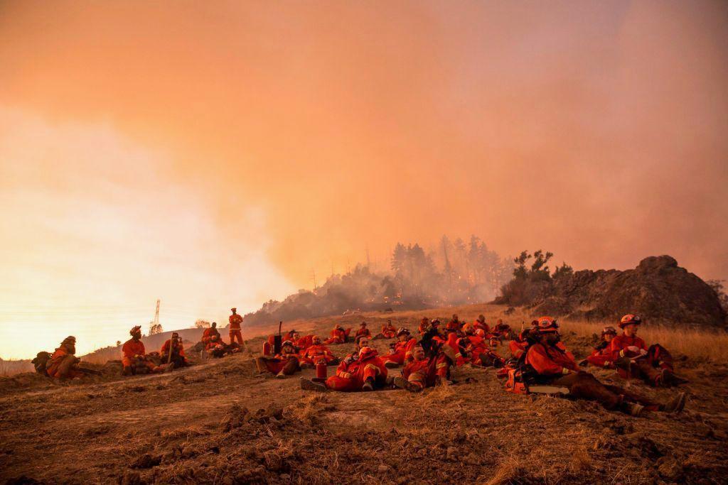 A crew of inmate firefighters takes a break during operations after U.S. officials ordered about 50,000 people to evacuate parts of the San Francisco Bay area on Oct. 26, 2019. (©Getty Images | <a href="https://www.gettyimages.com.au/detail/news-photo/crew-of-inmate-firefighters-takes-a-break-during-news-photo/1178415226">PHILIP PACHECO/AFP</a>)