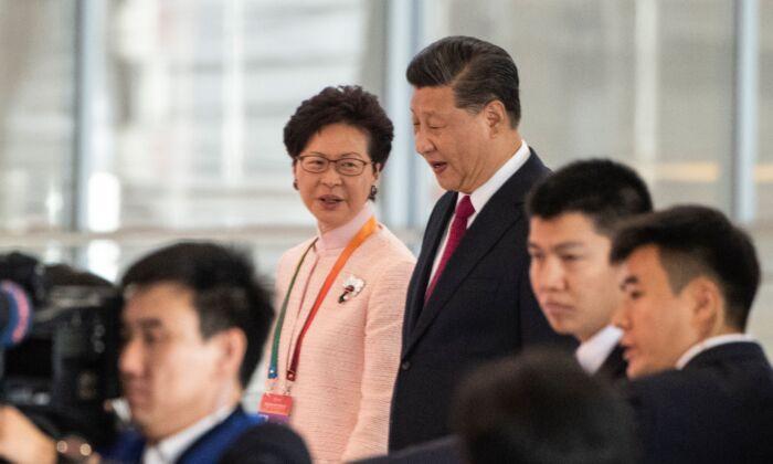 In Rare Meeting, China’s Xi Backs Carrie Lam’s Handling of Hong Kong Protests