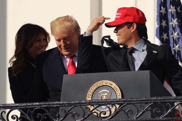 President Donald Trump reacts to Washington National catcher Kurt Suzuki wearing a 'Make America Great Again' cap during a celebration of the 2019 World Series Champions at the White House on Nov. 4, 2019. (Chip Somodevilla/Getty Images)