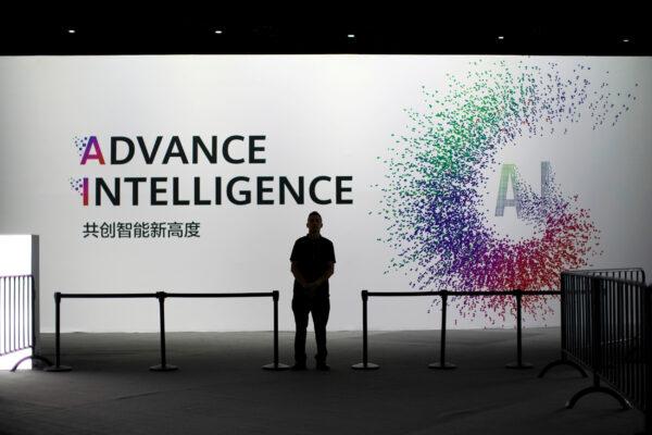A security officer keeps watch in front of an AI (artificial intelligence) sign at the annual Huawei Connect event in Shanghai, China on Sept. 18, 2019. (Aly Song/Reuters)