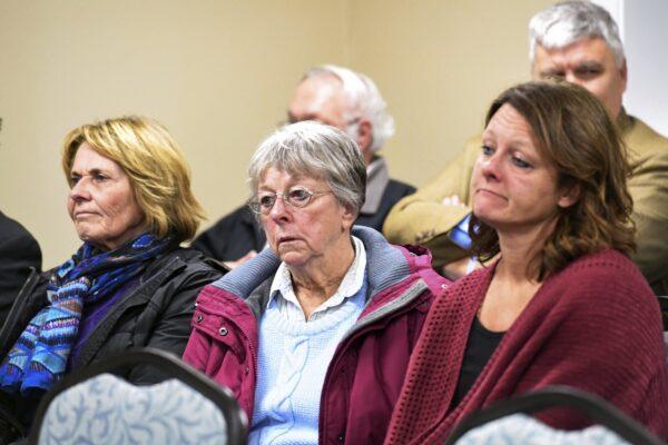 The family of victim Donnivan Schaeffer listens to a description of Charles Rhines' last words, "forgiving" them for their hatred of him, at the South Dakota State Penitentiary in Sioux Falls, S.D., on Nov. 4, 2019. (Erin Bormett/The Argus Leader via AP)