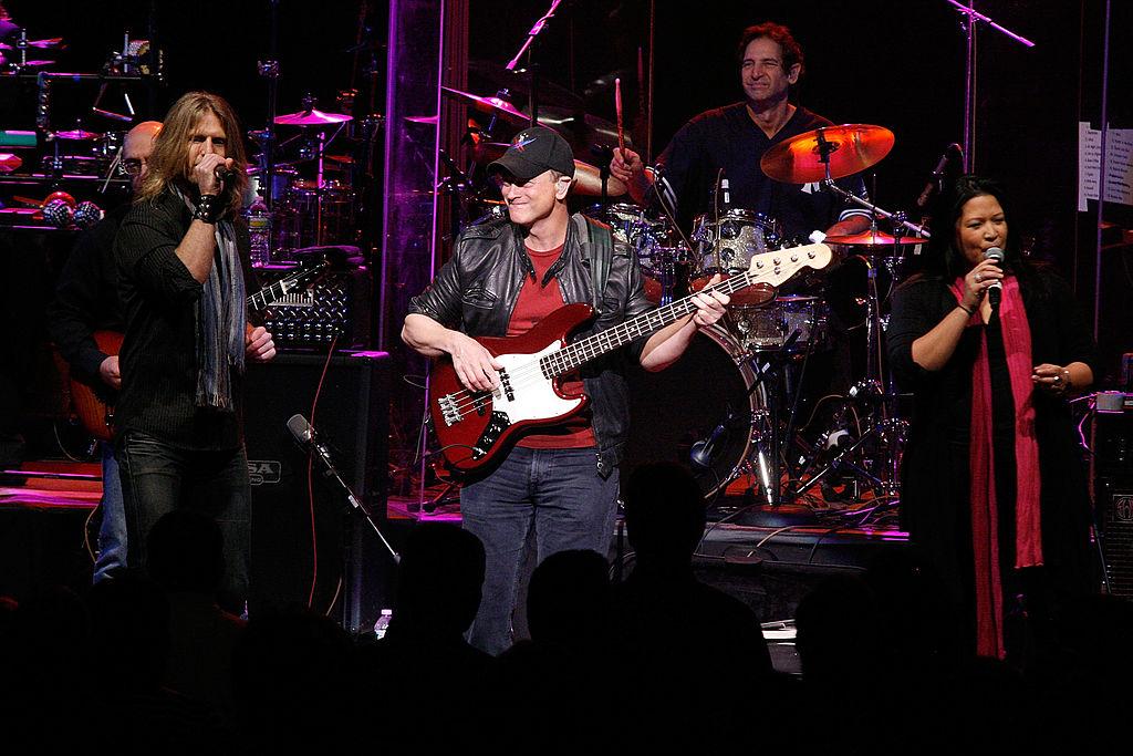 Gary Sinise and the Lt. Dan band performing a benefit concert in 2012 (©Getty Images | <a href="https://www.gettyimages.com/detail/news-photo/gary-sinise-performs-at-the-benefit-concert-for-army-spc-news-photo/143503816?adppopup=true">Andy Kropa</a>)