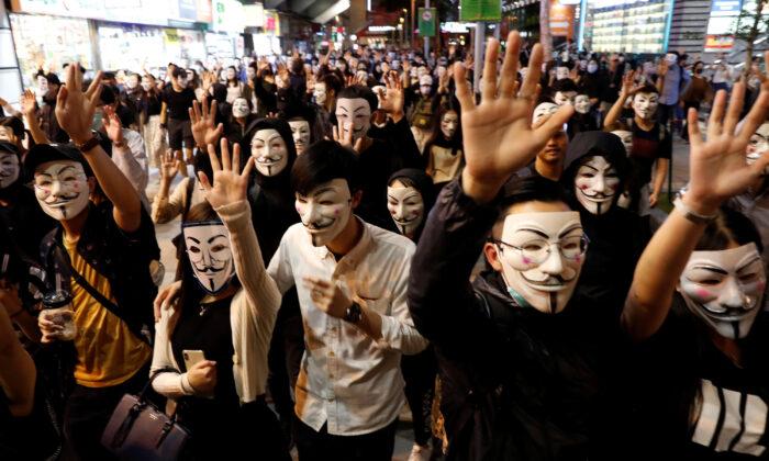 Masked Protesters Take to Hong Kong Streets