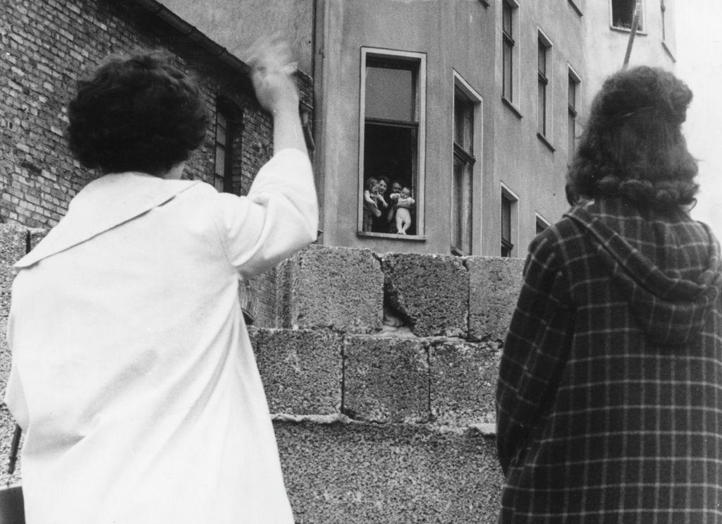 Two mothers can only wave to their children and grandchildren in the Soviet sector of Berlin from across the Berlin Wall in this file photo. (Keystone/Getty Images)