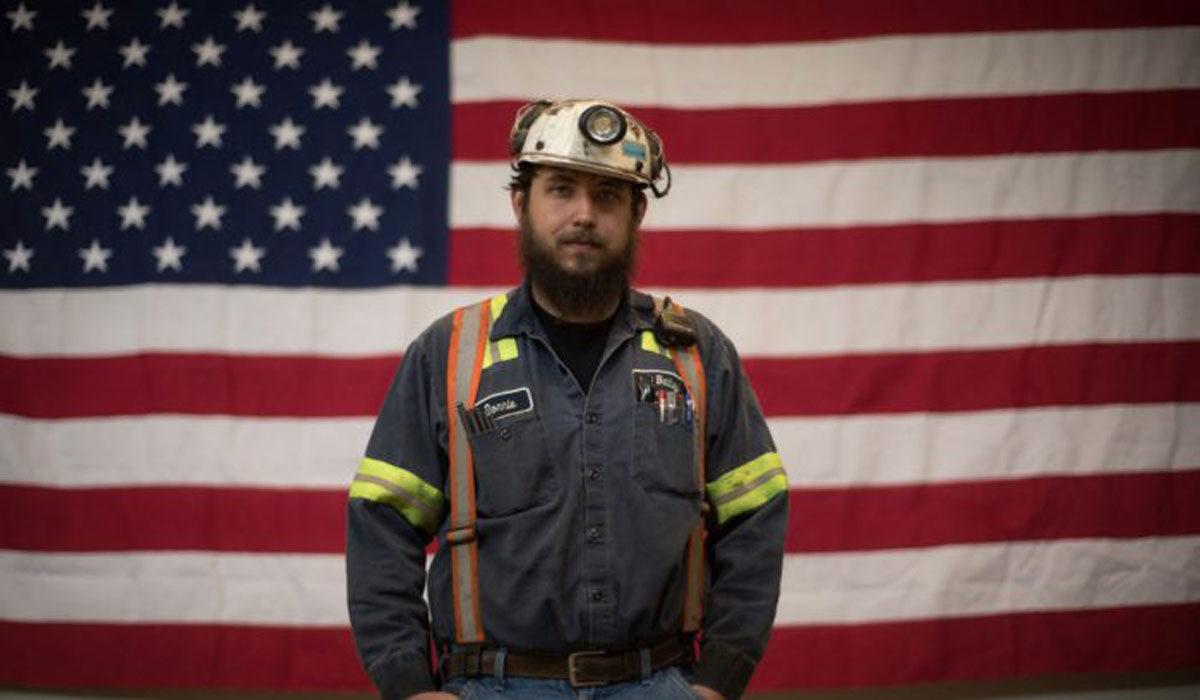 Donnie Claycomb, of Limestone, W.Va., who has been mining for six years, stands in front of a U.S. flag at the Harvey Mine in Sycamore, Pa., on April 13, 2017. (Justin Merriman/Getty Images)