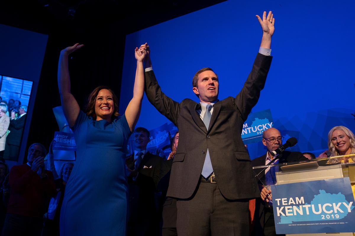 Democratic gubernatorial candidate and Kentucky Attorney General Andy Beshear, along with lieutenant governor candidate Jacqueline Coleman, acknowledge supporters at the Kentucky Democratic Party election night watch event in Louisville, Ky. on Nov. 5, 2019. (AP Photo/Bryan Woolston)
