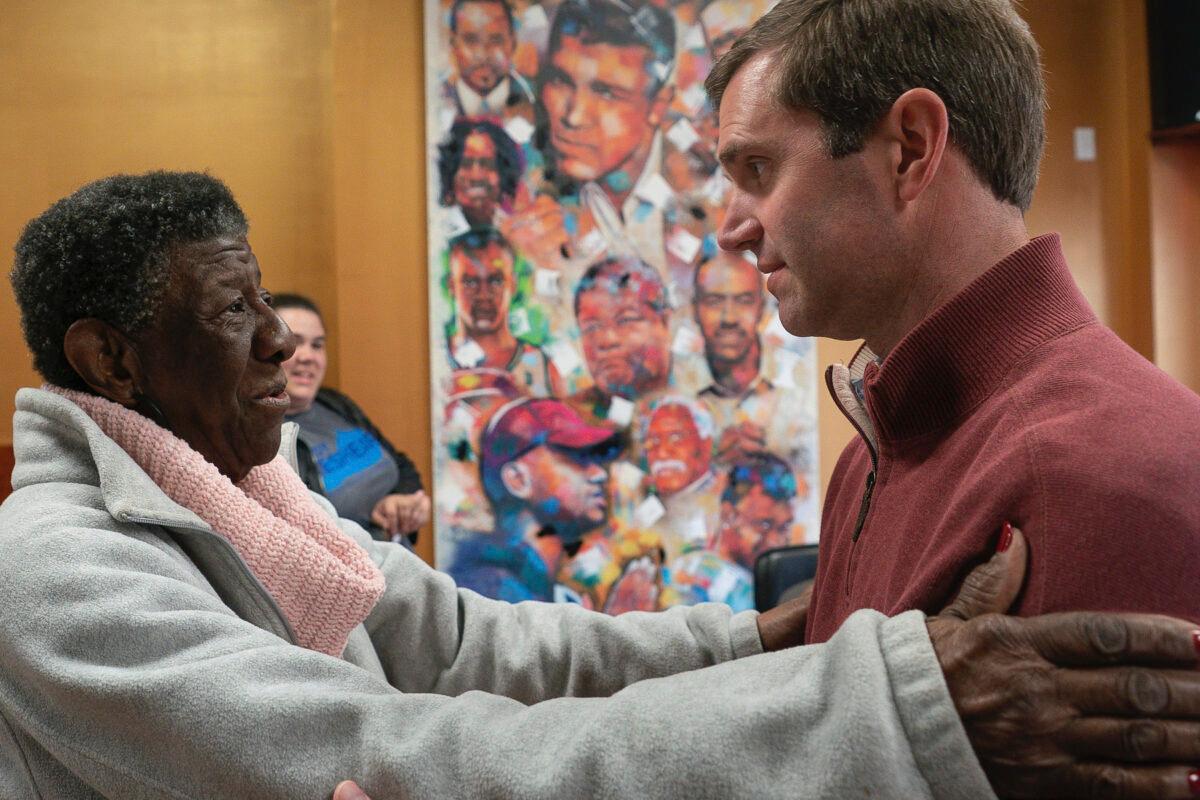 Kentucky Attorney General and Democratic gubernatorial candidate Andy Beshear, right, speaks with Maddie Jones, of West Louisville, during a campaign stop at Southern Hospitality, in Louisville, Ky. on Nov. 5, 2019. (Bryan Woolston/AP Photo)