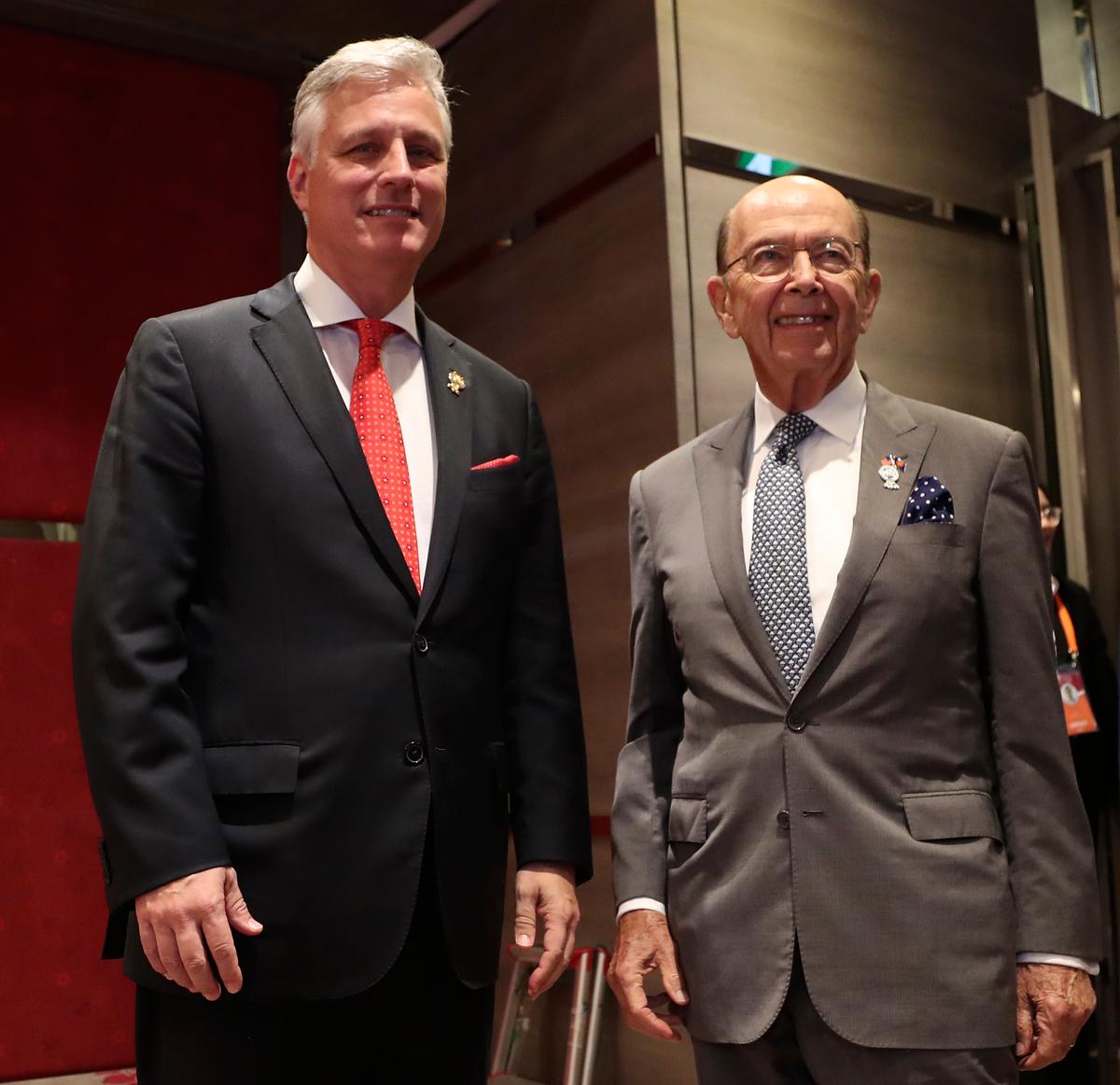 U.S. National Security Adviser Robert O'Brien, left, and Commerce Secretary Wilbur Ross arrive for the bilateral meeting with Japanese Prime Minister Shinzo Abe at the Association of Southeast Asian Nations (ASEAN) summit in Nonthaburi, Thailand on Nov. 4, 2019. (Aijaz Rahi/AP)