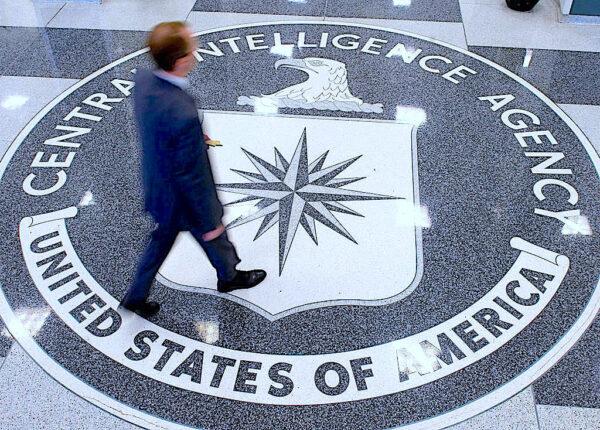 A man crosses the Central Intelligence Agency (CIA) logo in the lobby of CIA Headquarters in Langley, Virginia, on August 14, 2008. (SAUL LOEB/AFP via Getty Images)