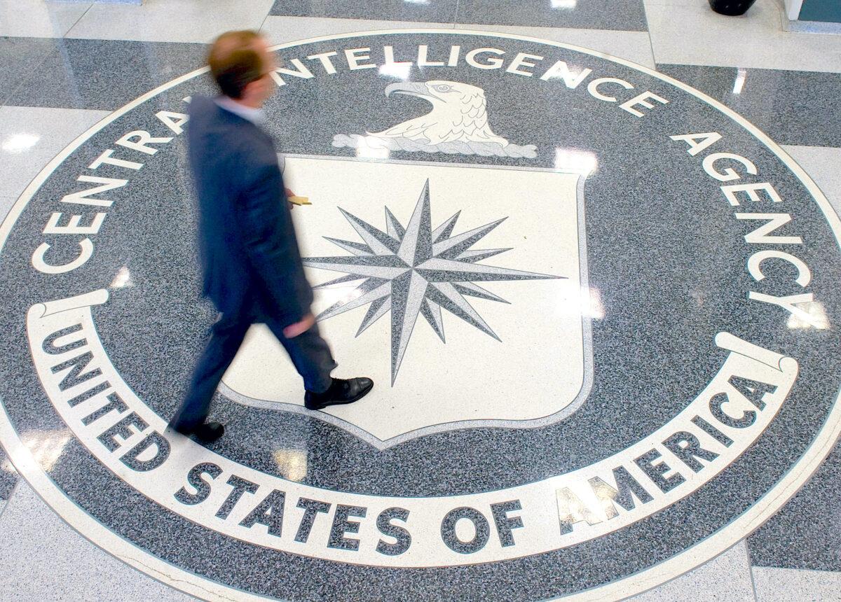 A man crosses the Central Intelligence Agency logo in the lobby of agency headquarters in Langley, Va., on Aug. 14, 2008. (Saul Loeb/AFP via Getty Images)