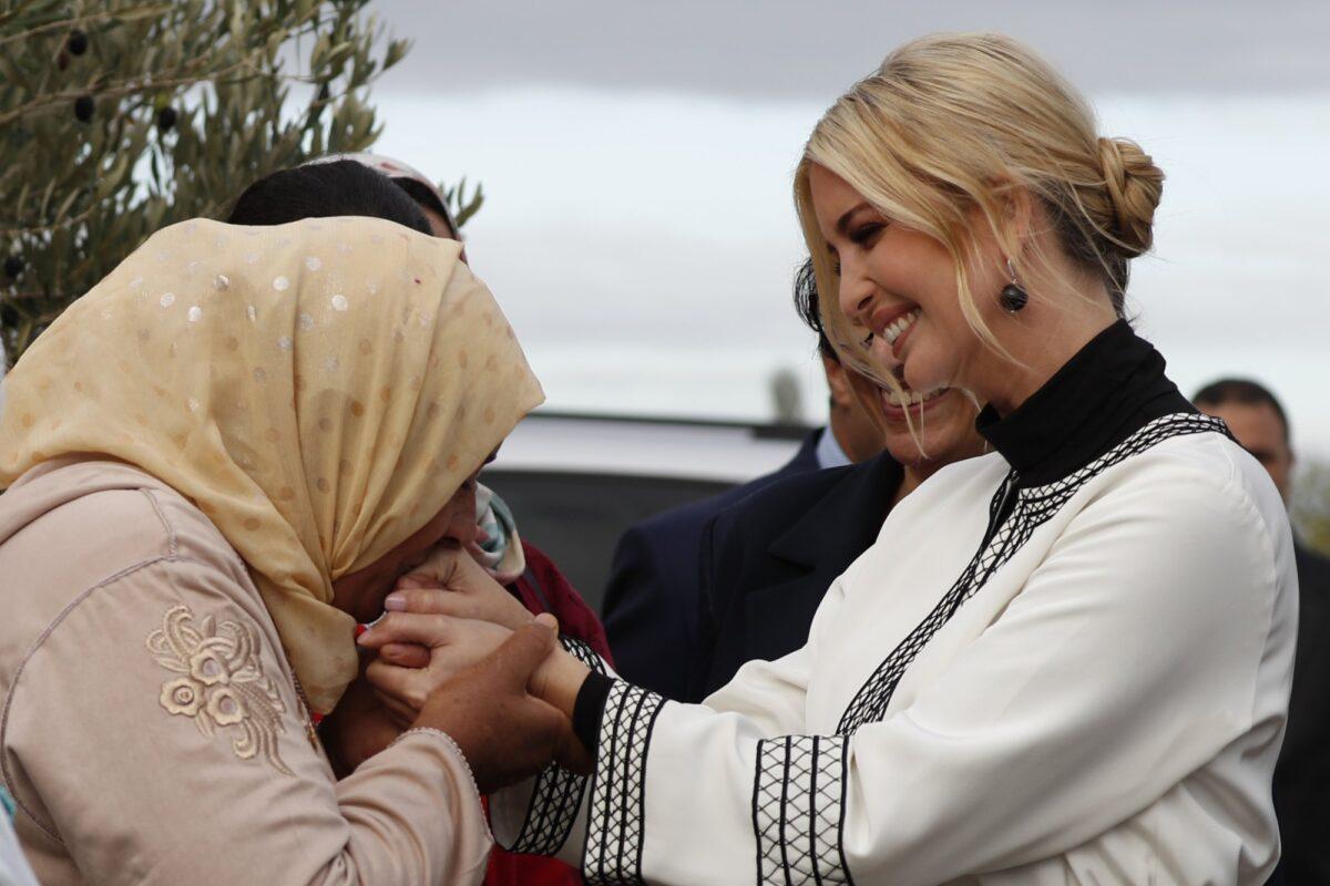 Farmer Aicha Bourkib kisses Ivanka Trump's hand, the daughter and senior adviser to President Donald Trump, in the province of Sidi Kacem, Morocco on Nov. 7, 2019, as Ivanka Trump tours an olive grove collective where local women farmers are benefitting from changes allowing them to inherit land. (Jacquelyn Martin/AP Photo)