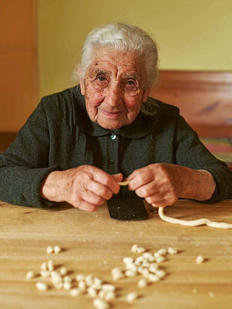 Giuseppa, 97, makes tiny Sardinian maccarones de ungia, 'fingernail pasta.' She is also a tailor specializing in traditional Sardinian men’s costumes—and still makes the clothes for all nine men in her family. (Emma Lee)
