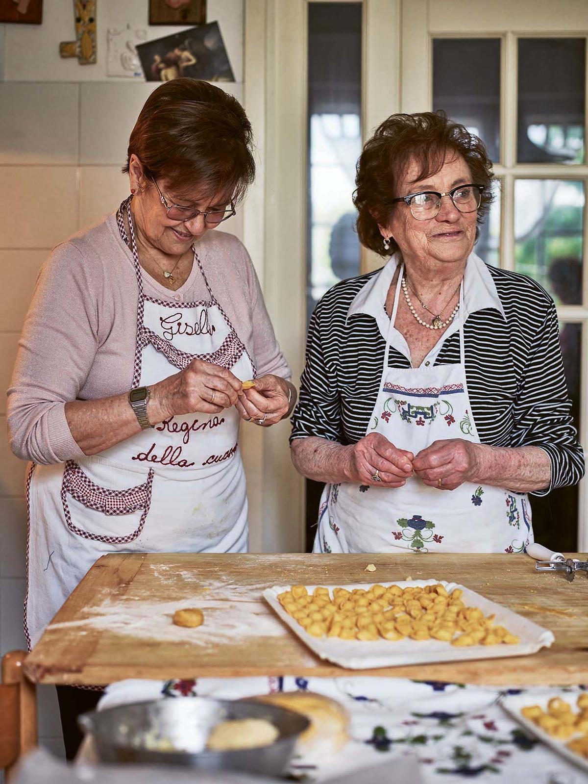 Maria (R) makes cappelletti, traditionally a Christmas Day treat. Fillings vary across Emilia Romagna; in Faenza, Maria uses a mixture of cheeses. (Emma Lee)