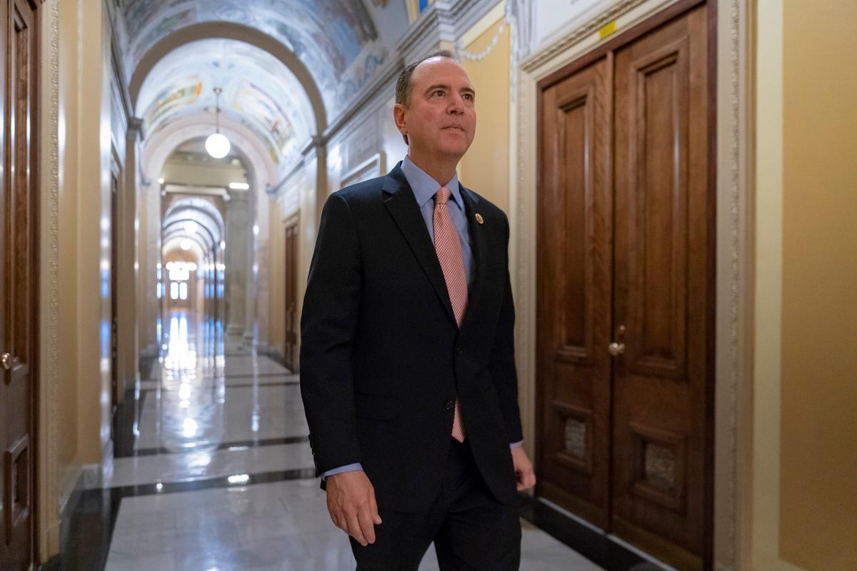 Rep. Adam Schiff (D-Calif.), chairman of the House Intelligence Committee, walks to a secure area at the Capitol to interview a witness in the House impeachment inquiry in Washington on Nov. 6, 2019. (AP Photo/J. Scott Applewhite)