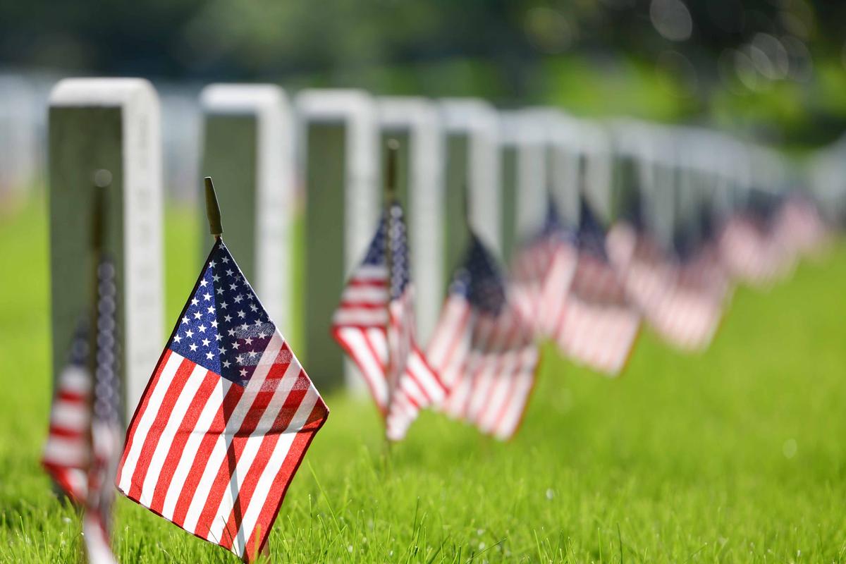 Illustration - Shutterstock | <a href="https://www.shutterstock.com/image-photo/united-states-national-flags-ant-headstones-1041465589?src=80fb3df9-c5c5-4d3c-a7d2-c58f151088a6-1-8">Orhan Cam</a>