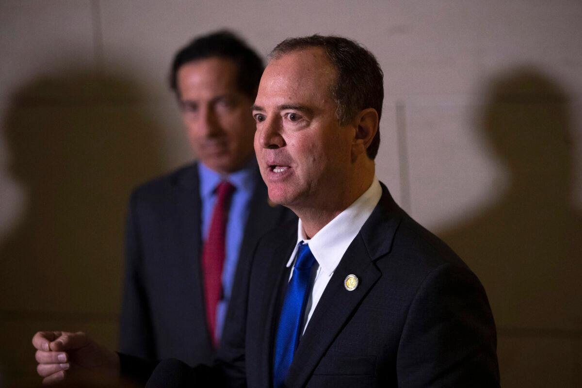 (L-R) Rep. Jamie Raskin (D-Md.) stands next to House Intelligence Committee Chairman Rep. Adam Schiff (D-Calif.) as he speaks to reporters following a closed-door hearing with the House Intelligence, Foreign Affairs and Oversight committees at the U.S. Capitol in Washington on Nov. 4, 2019. (Drew Angerer/Getty Images)