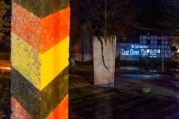 A light installation and a video projection at the former East German-West German border in Moedlareuth traces a section of the former course of the wall in Moedlareuth, Germany, on Nov 4, 2019. (Reuters/Matthias Rietsche)