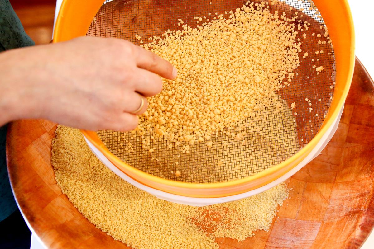 Multiple rounds of sieving ensure couscous of uniform size. (Samira Bouaou/The Epoch Times)