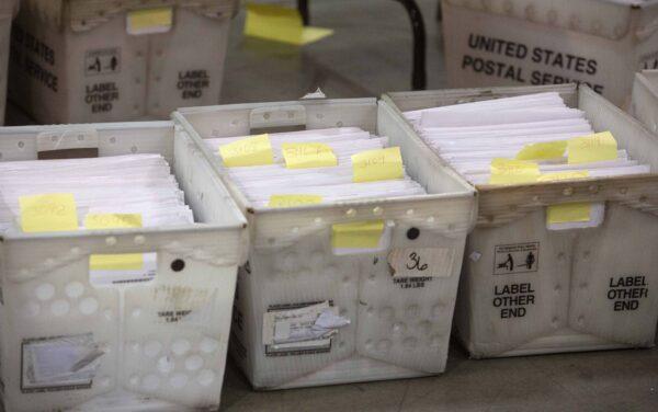 Election ballot baskets sit on the floor at the Supervisor of Elections Service Center in Palm Beach, Fla., on Nov. 18, 2018. (Saul Martinez/Getty Images)