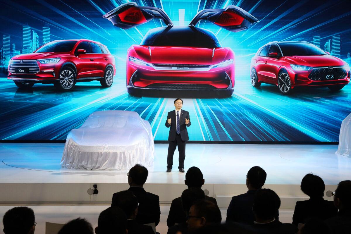 Wang Chuanfu, chairman and president of BYD Auto, the biggest global electric brand by sales volume, prepares to show the latest cars during the Auto Shanghai 2019 show in Shanghai on April 16, 2019. (Ng Han Guan/AP)