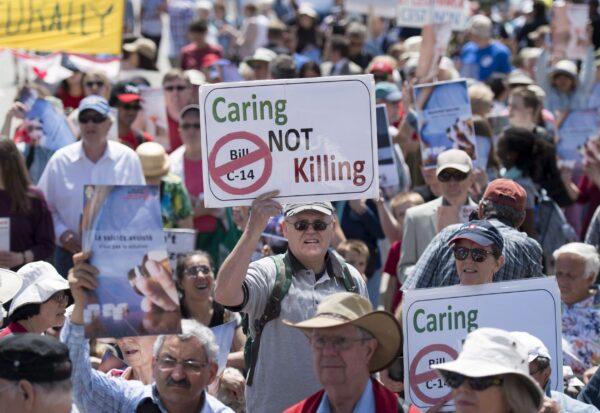 People rally against Bill C-14, the medically assisted dying bill, during a protest organized by the Euthanasia Prevention Coalition on Parliament Hill on June 1, 2016, in Ottawa. (The Canadian Press/Justin Tang)