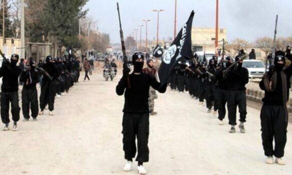 ISIS extremists parade down a street in Raqqa, Syria, on Jan. 14, 2014. (ISIS Website via AP)