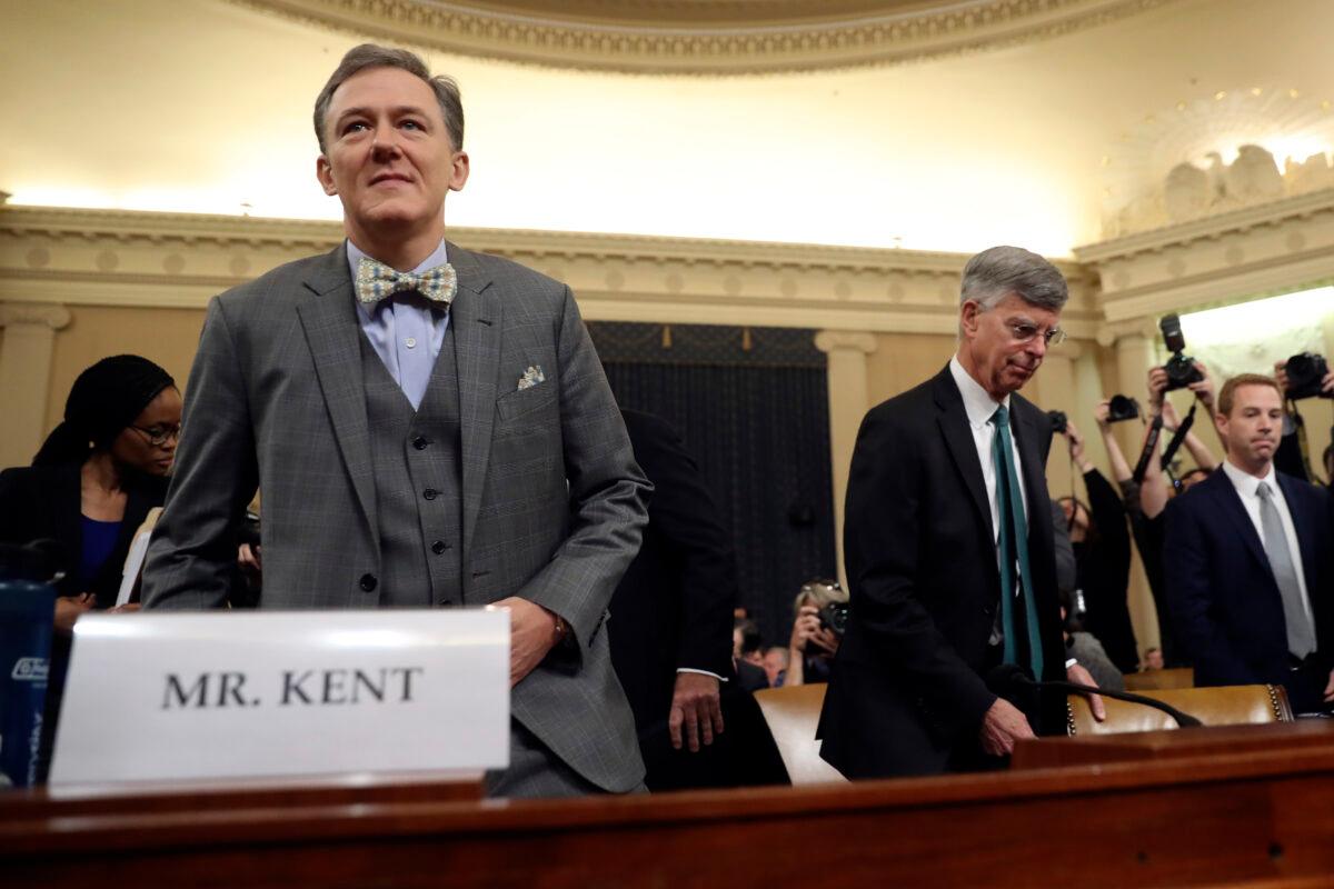 Top U.S. diplomat in Ukraine William Taylor, right, and career Foreign Service officer George Kent, arrive to testify before the House Intelligence Committee on Capitol Hill in Washington on Nov. 13, 2019. (AP Photo/Andrew Harnik)