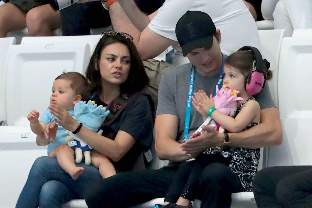Kutcher, Kunis, and their children watch the diving competition at the 2017 FINA World Championships in Budapest, Hungary, on July 17, 2017. (©Getty Images | <a href="https://www.gettyimages.com.au/detail/news-photo/actors-ashton-kutcher-and-his-wife-mila-kunis-attend-the-news-photo/816112452">STRINGER/AFP</a>)
