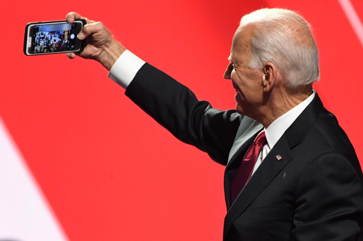 Former Vice President Joe Biden takes a selfie with supporters after the fourth Democratic primary debate of the 2020 presidential campaign season at Otterbein University in Westerville, Ohio on Oct. 15, 2019. (Saul Loeb/AFP via Getty Images)