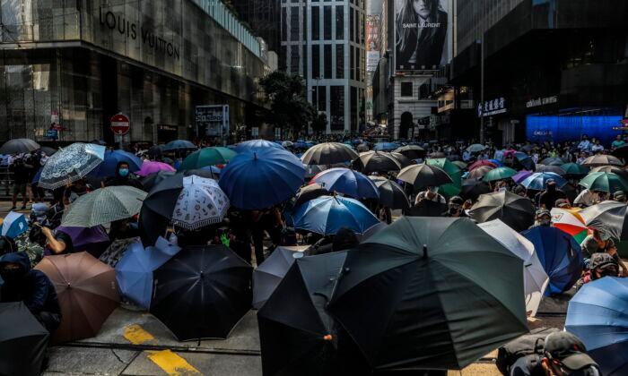 Beijing Signals Tougher Tactics on Hong Kong as City Government Convenes Emergency Meeting