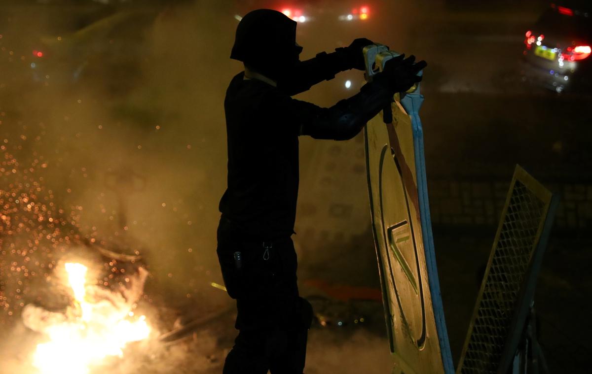 Anti-government protester makes a barricade at the Chinese University in Hong Kong on Nov. 13, 2019. (Athit Perawongmetha/Reuters)