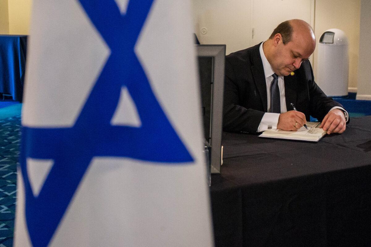 Ambassador of Ukraine to the United States Valeriy Chaly, signs a condolence book for honoring former prime minister of Israel Shimon Peres at the Embassy of Israel in Washington on Sept. 30, 2016. (Zach GIbson/AFP via Getty Images)