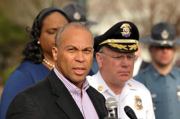 Then-Massachusetts Gov.Deval Patrick (L) speaks to the media in a 2013 file photograph. (Stan Honda/AFP/Getty Images)