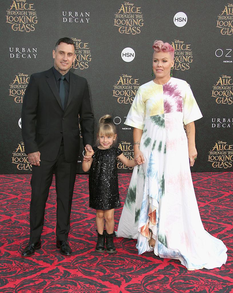 Pink and her family at the premier for "Alice Through the Looking Glass" in 2016 (©Getty Images | <a href="https://www.gettyimages.com/detail/news-photo/motorcycle-racer-carey-hart-willow-sage-hart-and-singer-news-photo/533867558?adppopup=true">Frederick M. Brown</a>)