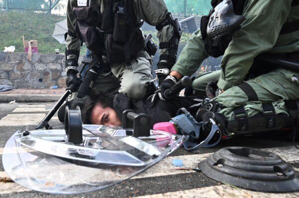 A man is detained after police fired tear gas at CUHK on Nov. 12, 2019. ( Philip Fong/AFP via Getty Images)