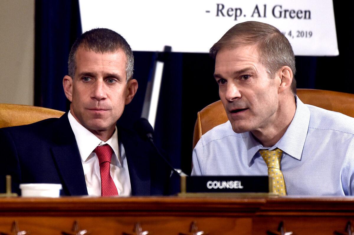 Rep. Jim Jordan (R-Ohio), and minority counsel Steve Castor confer during the first public impeachment hearing on Nov. 13, 2019. (Olivier Douliery/AFP via Getty Images)
