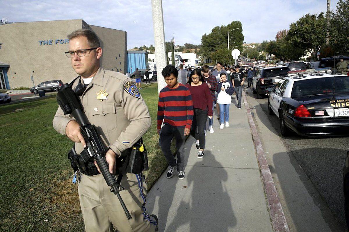 Students are escorted out of Saugus High School after reports of a shooting in Santa Clarita, Calif., on Nov. 14, 2019. (Marcio Jose Sanchez/AP Photo)