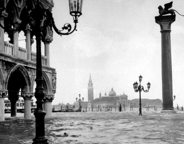 The Palace of Doges, partly seen left, and St. George's Church, centre, are under several feet of water, due to heavy rains, in Venice, Italy, Nov.5, 1966. (AP photo)