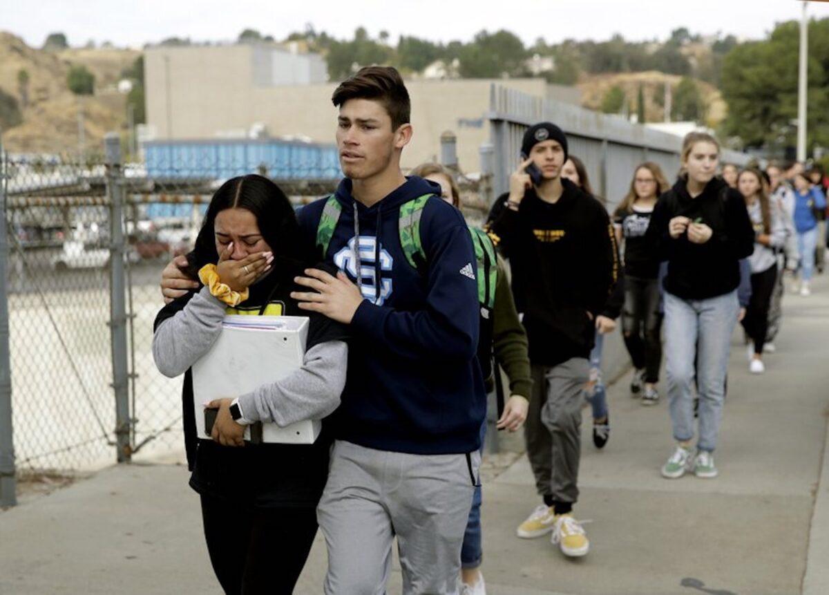 Students are escorted out of Saugus High School after reports of a shooting, in Santa Clarita, Calif., on Nov. 14, 2019. (Marcio Jose Sanchez/AP Photo)