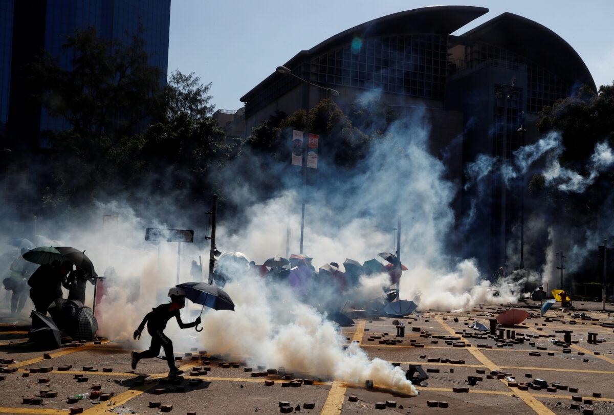 Protesters clash with police outside Hong Kong Polytechnic University (PolyU) in Hong Kong, on Nov. 17, 2019. (Thomas Peter/Reuters)