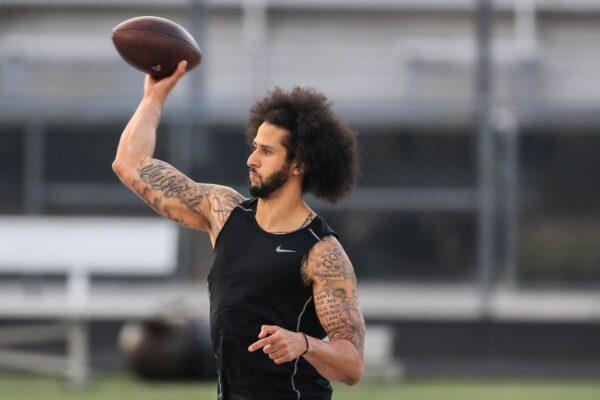 Colin Kaepernick makes a pass during a private NFL workout held at Charles R. Drew High School in Riverdale, Ga., on Nov. 16, 2019. (Photo by Carmen Mandato/Getty Images)