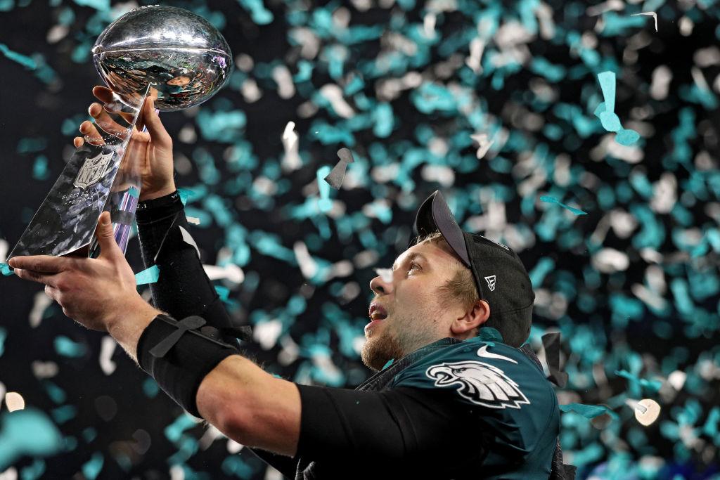 Nick Foles raising the Vince Lombardi trophy after the Philadelphia Eagles won Super Bowl LII (©Getty Images | <a href="https://www.gettyimages.com/detail/news-photo/quarterback-nick-foles-of-the-philadelphia-eagles-raises-news-photo/914529620?adppopup=true">Patrick Smith</a>)