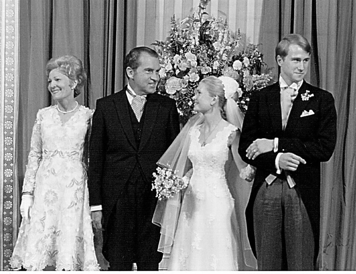 First Lady Pat Nixon, President Richard Nixon, Tricia Nixon, and Ed Cox pose for photographers at wedding reception at the White House on June 12, 1971. (National Archive/Newsmakers)